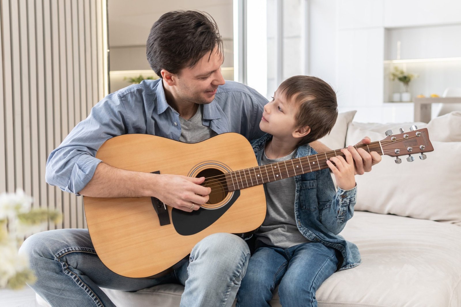 father-teaches-son-to-play-the-guitar-2021-10-07-06-16-29-utc.jpg